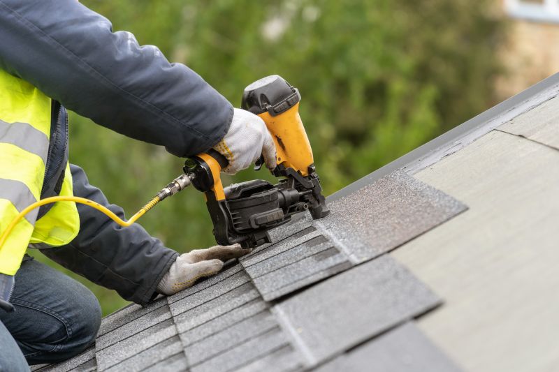 Repair Specialist Applying Shingles